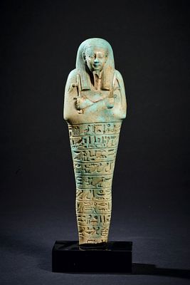 Shabti of Nefer-ib-Re-sa-Neith. Turquoise faience, H 16.8cm. Late Period, 26th dynasty, reign 