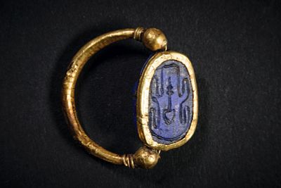 Gold ring with a scarab. Golden ring with a scarab of lapislazuli witth hieroglyphs on the 