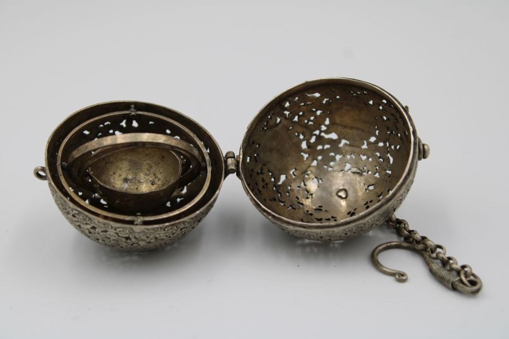 Lot 57: Antique Islamic white metal spinning globe, adorned with...