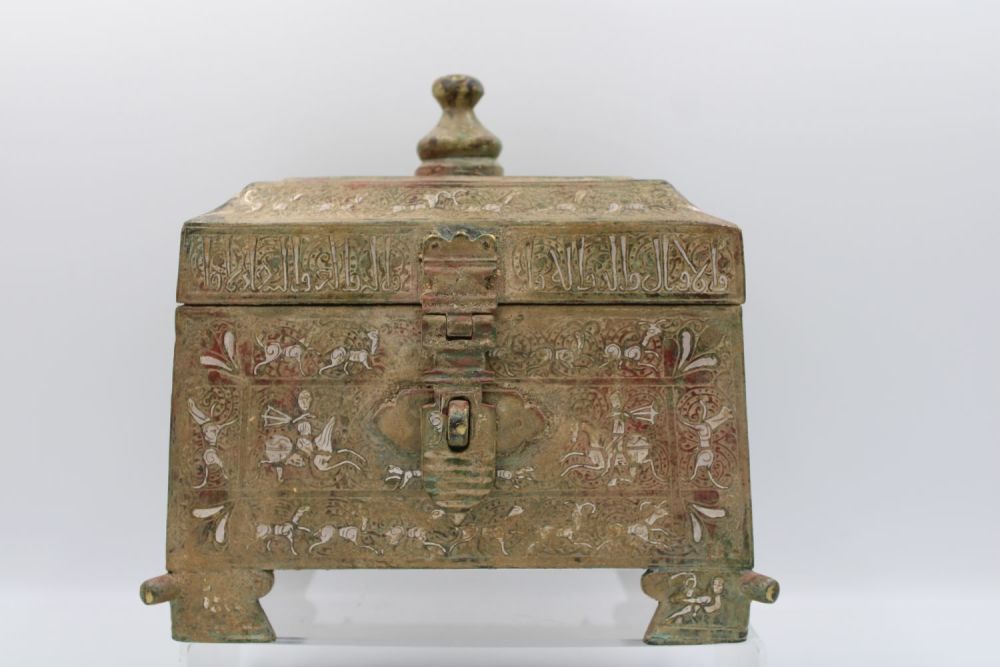 Lot 59: Islamic jewellery box adorned with intricate silver inlay,...