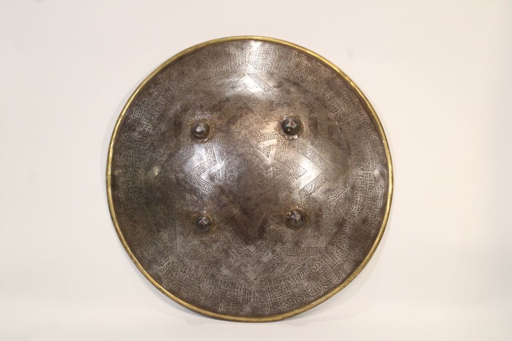 Lot 83: A remarkable 19th-century Indian Islamic shield, crafted from...