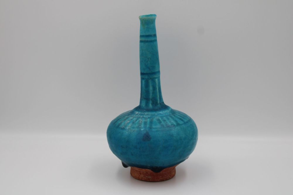Lot 98: 12th-13th Century Kashan Turquoise Bottle - A rare...