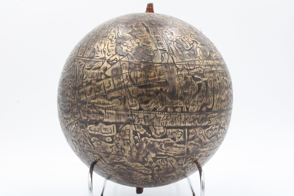 Lot 121: This sizable Islamic brass celestial globe, adorned with...