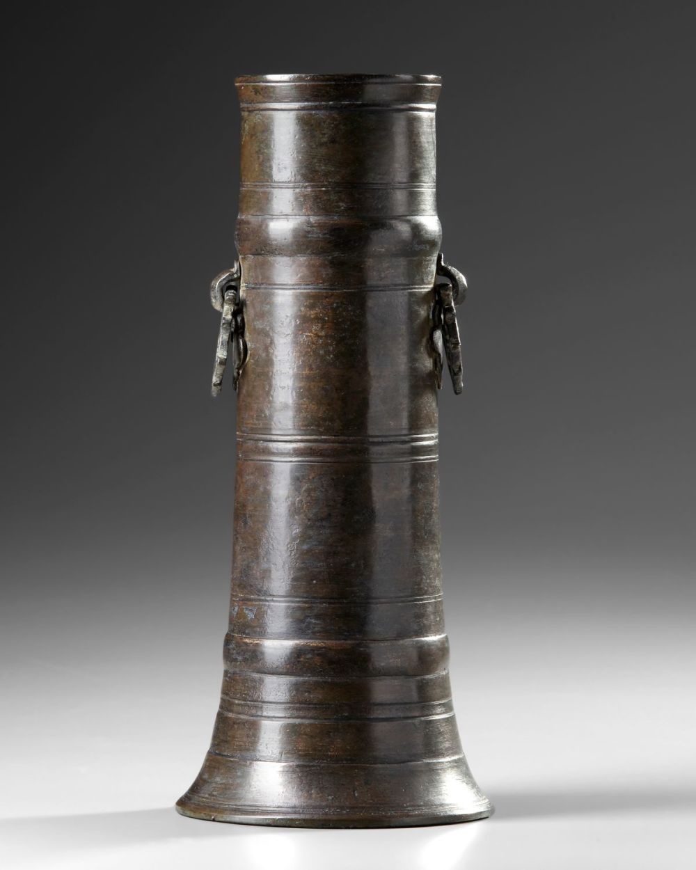 Lot 149: This 19th-century Indo-Persian brass candlestick holder.