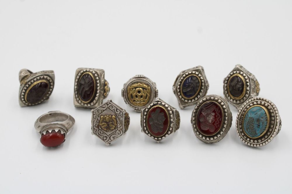 Lot 202: A collection of 10 silver and hard stone...