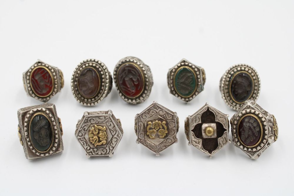 Lot 203: A collection of 10 silver and hard stone...