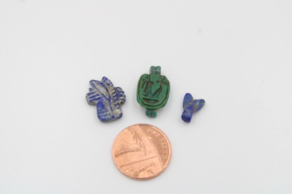 Lot 210: 3-Piece Egyptian Amulet Set: Lapis Eye, Stamp, and...