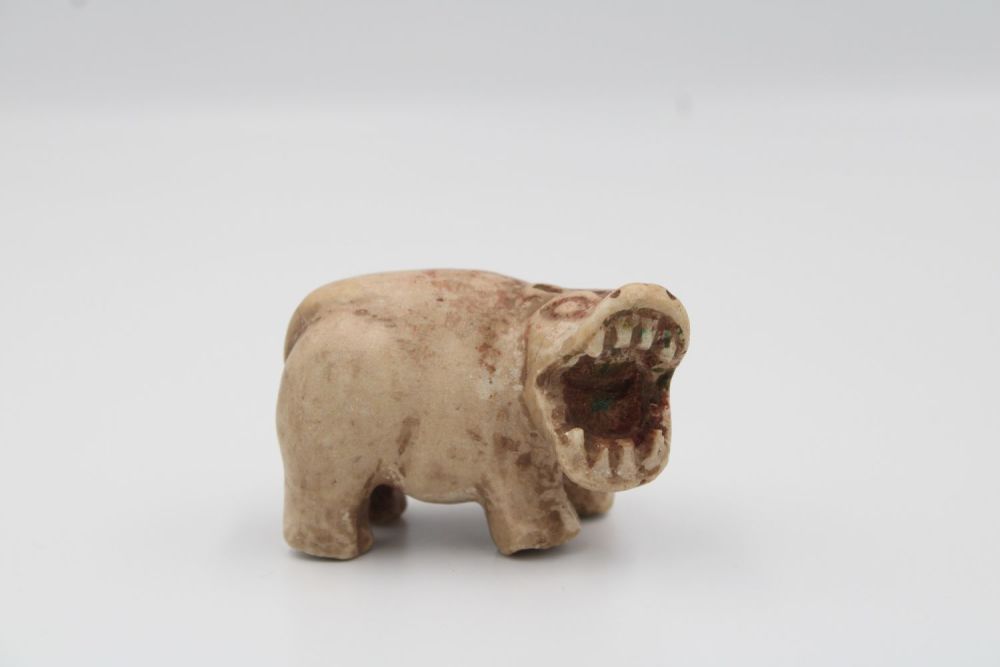 Lot 216: Exquisite and rare Egyptian white faience hippo figurine,...