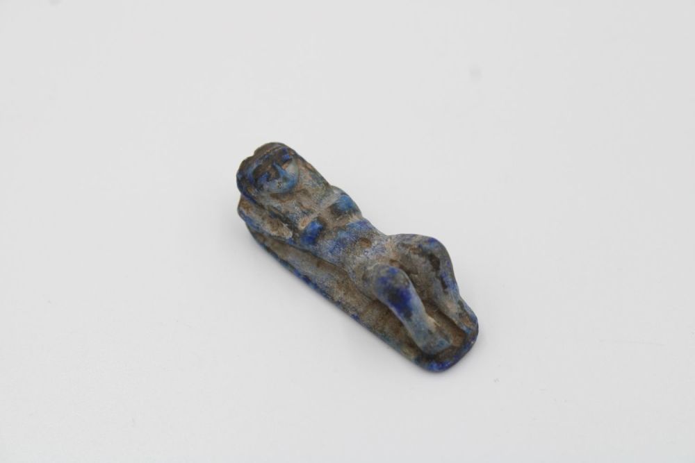 Lot 222: Ancient Egyptian lapis lazuli sculpture of reclining woman,...
