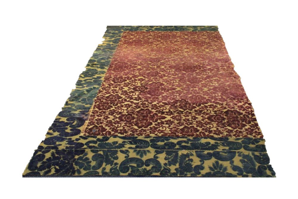 Lot 241: Russian "Velvet Tinsel" Rug Fragment: This striking red...