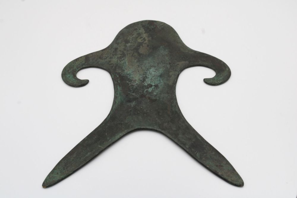 Lot 313: A bronze Anthropomorphic idol with patina likely from...