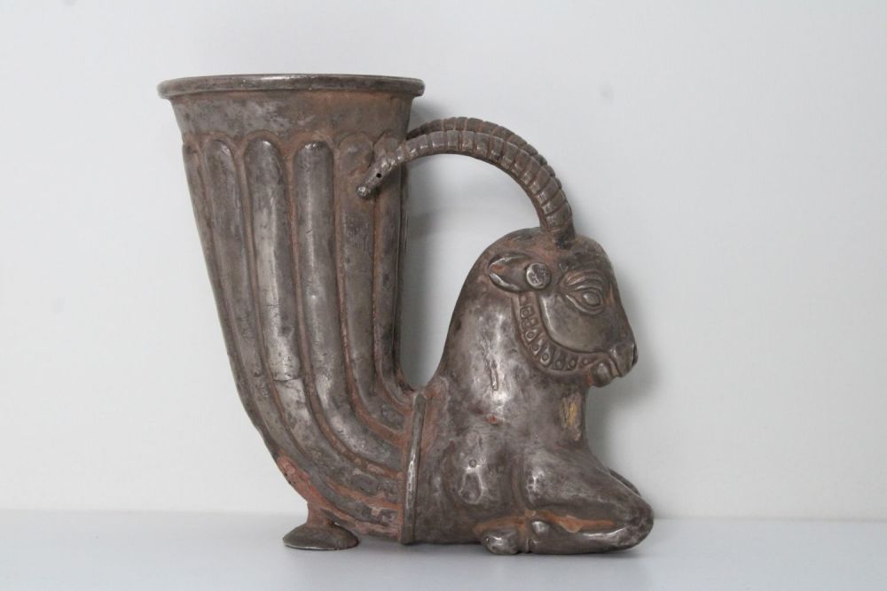 Lot 316: Parthian-Style Silver Rhyton with Horned Goat: This exquisite...