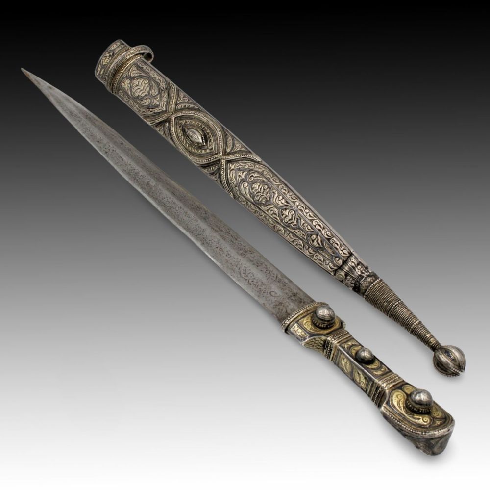 Lot 23: A Caucasian Sword with an Engraved Silver Handle...
