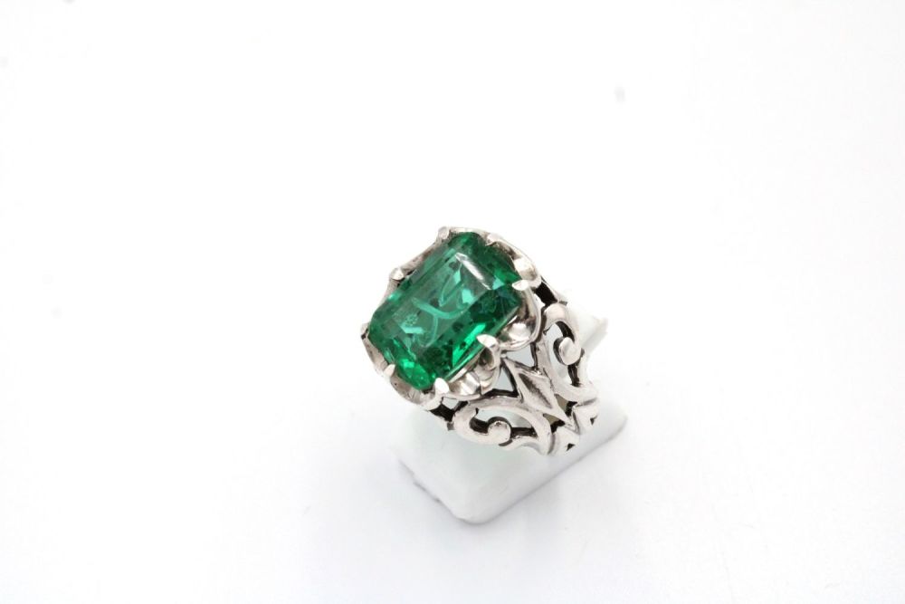 Lot 59: An Islamic Silver and Emerald Coloured Ring with...