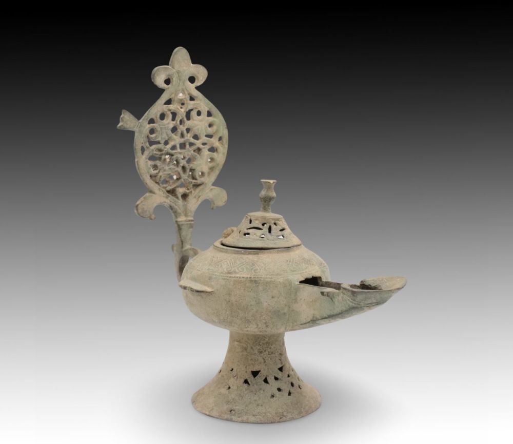 Lot 69: An Islamic Bronze Oil Lamp from the 12th...