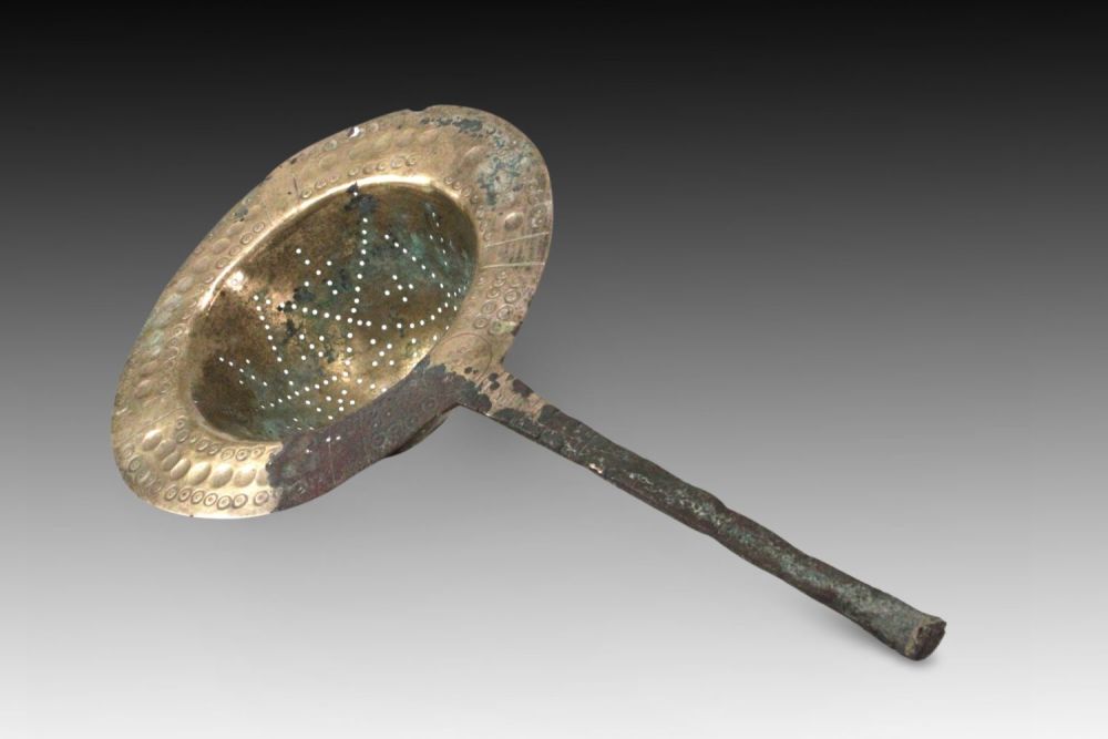 Lot 75: An Islamic Ghaznavid Bronze Sieve from the 13th...