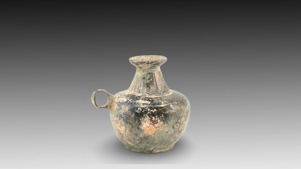 Lot 131: An Ancient Sasanian Bronze Small Jug with Cut...