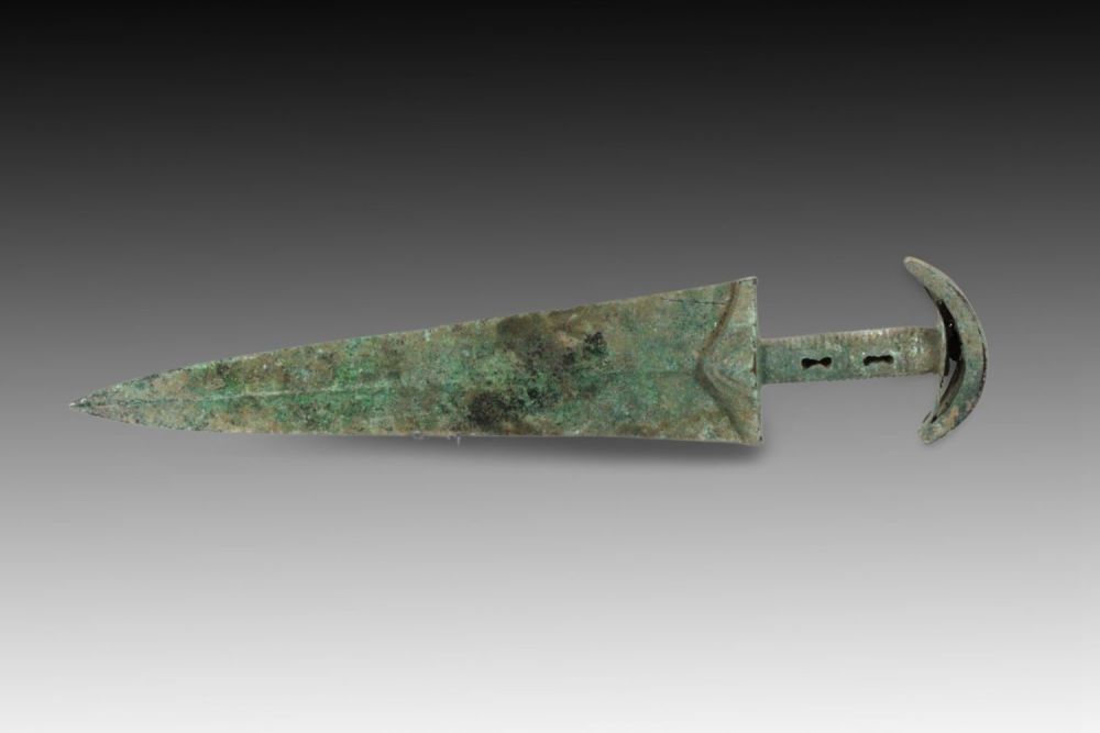 Lot 134: An Ancient Bronze Dagger from Circa 1800-600 BC...
