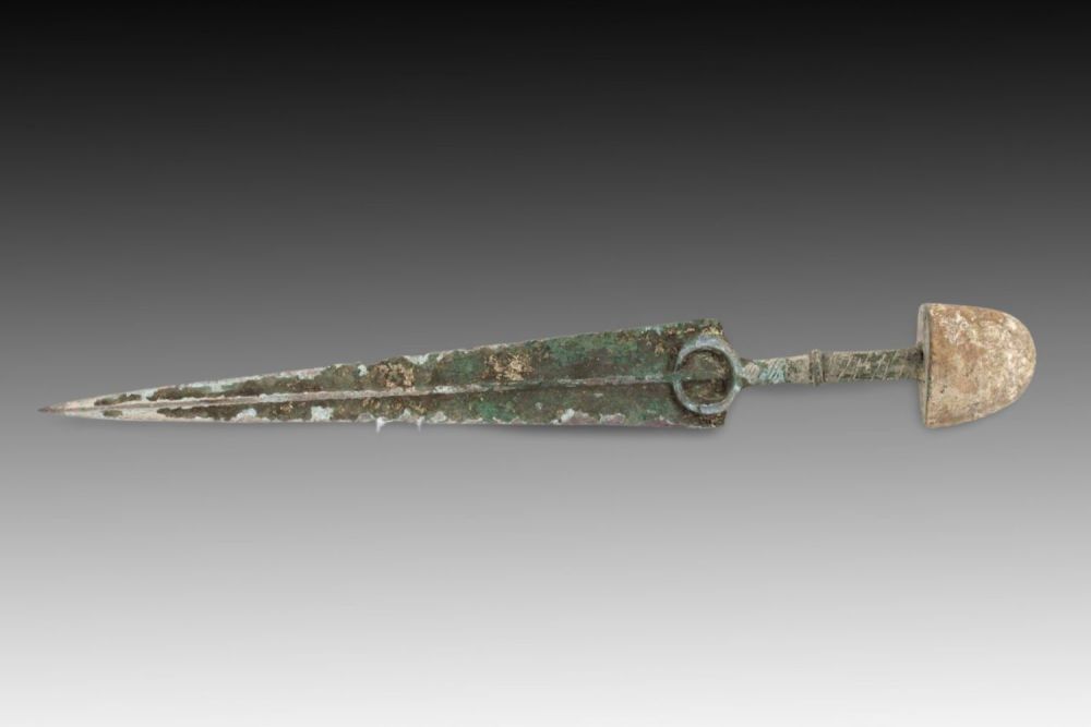 Lot 136: An Ancient Bronze Dagger from Circa 1800-600 BC...
