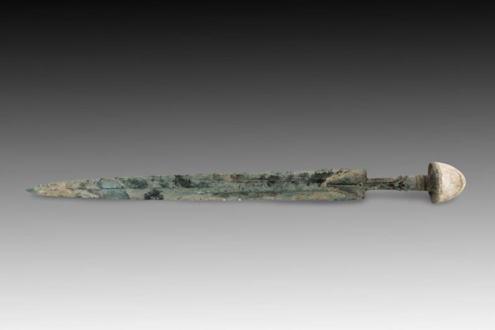 Lot 137: An Ancient Bronze Dagger from Circa 1800-600 BC...