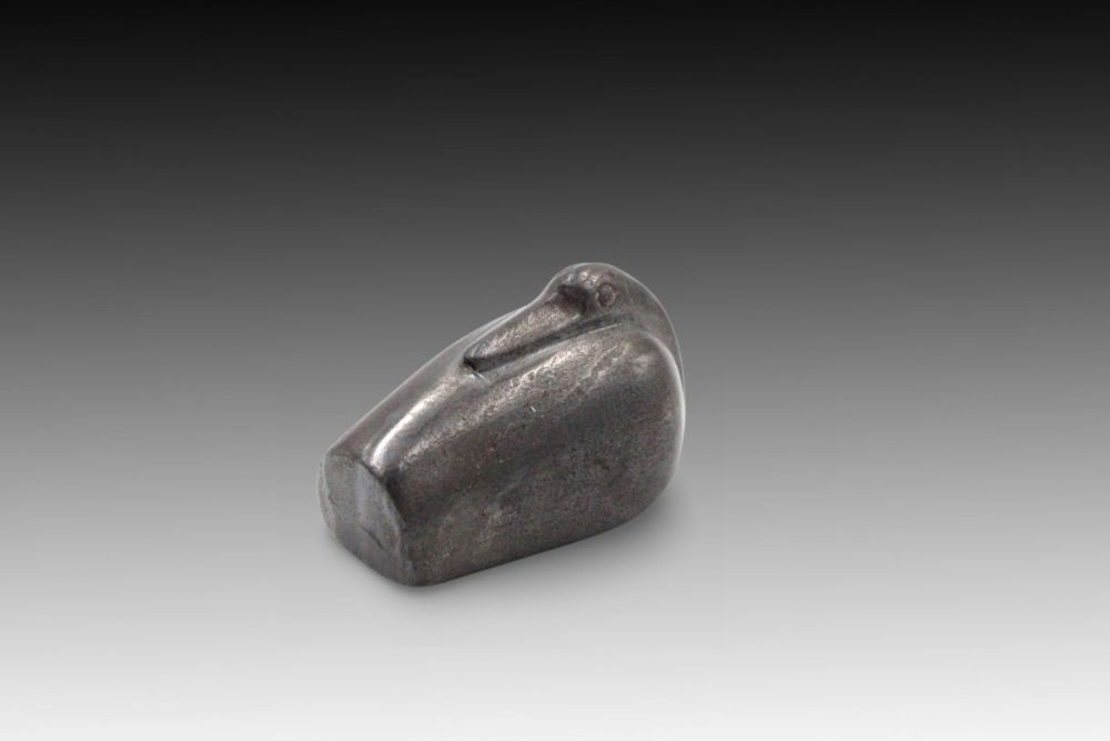 Lot 160: A Black Hematite Weight in the Form of...
