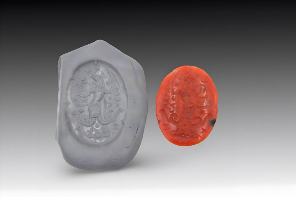 Lot 161: An Ancient Roman Intaglio Agate Stone with Inscription...