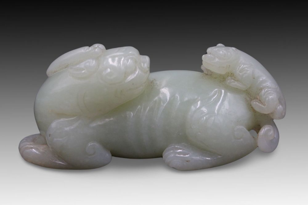 Lot 182: A Chinese Jade Mythical Lion with its Cub.