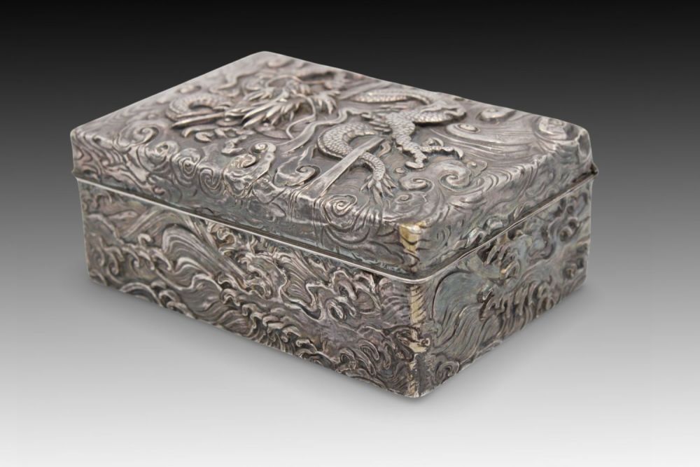 Lot 195: A Chinese Silver Jewellery Box with Dragon Carving...