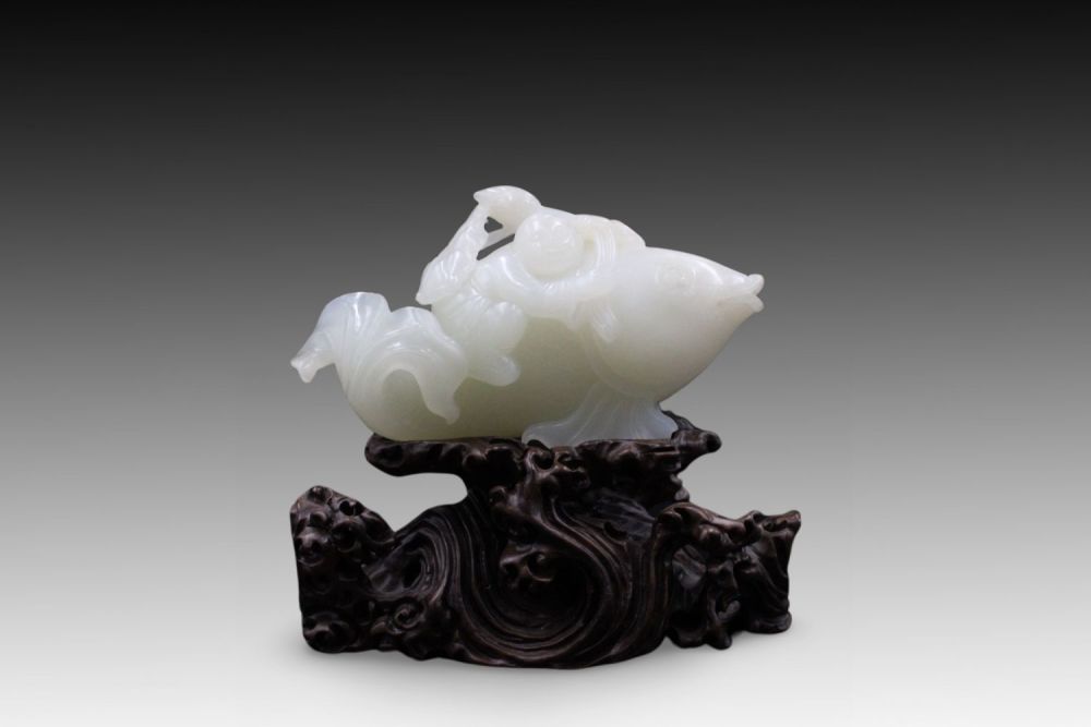 Lot 215: A Chinese White Jade Carving from the Qing...