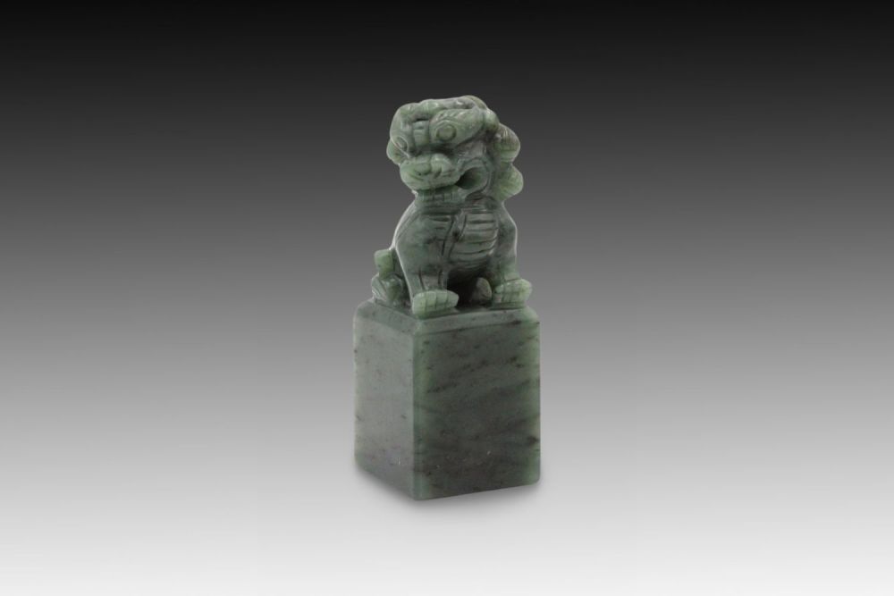 Lot 238: A Chinese Jade Carving of a Foo Dog