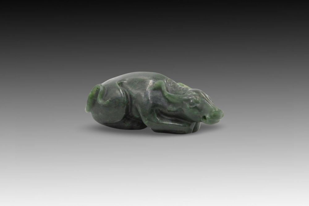 Lot 243: A Chinese Spinach Jade Figure of a Water...