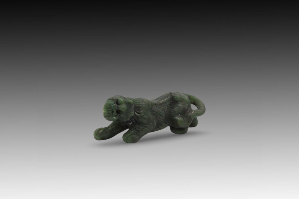 Lot 244: A Chinese Spinach Jade Carving of a Feng...