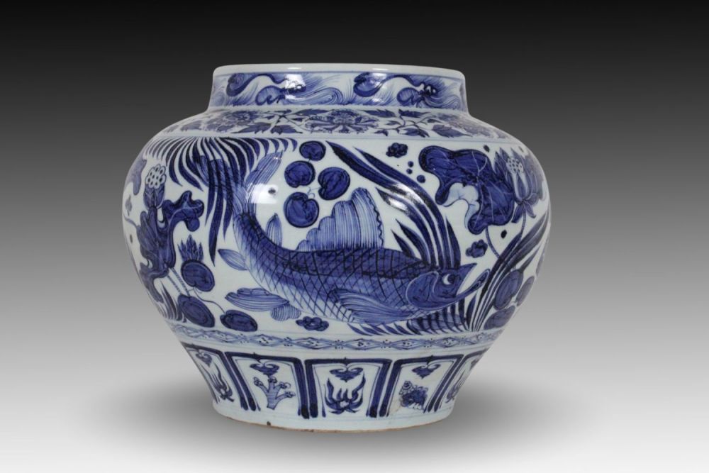 Lot 250: A Chinese Porcelain Wine Jar Depicting Fish and...