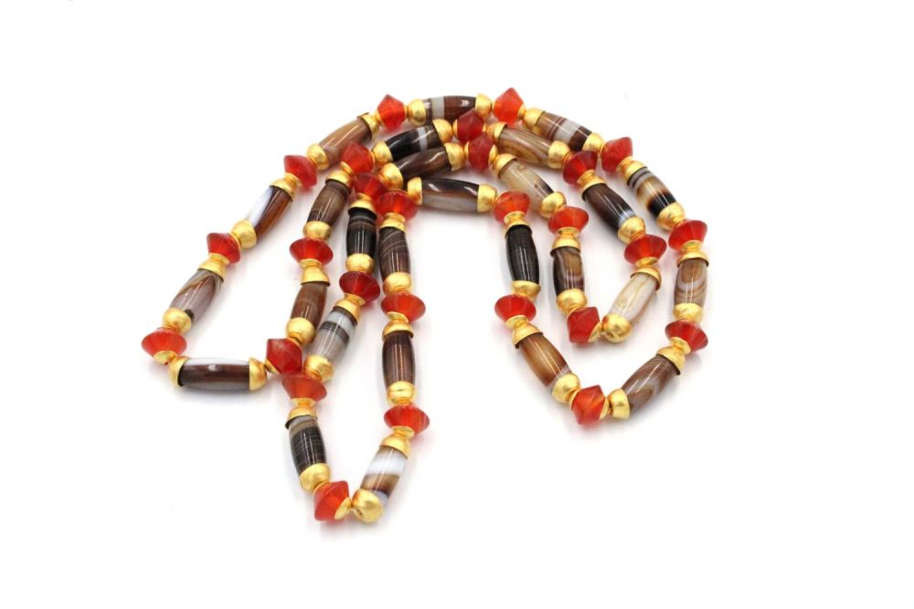 Lot 272: A Tibetan Agate with Red Carnelian Beads, Mounted...
