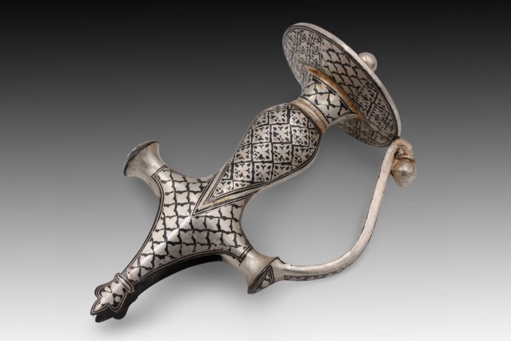 Lot 290: An Indian Sikh Sword Handle with Silver Plated...