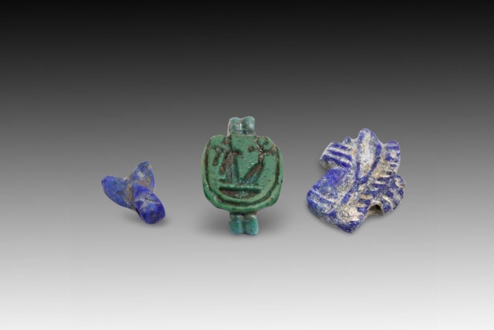 Lot 324: An Egyptian 3-Piece Amulet Set.