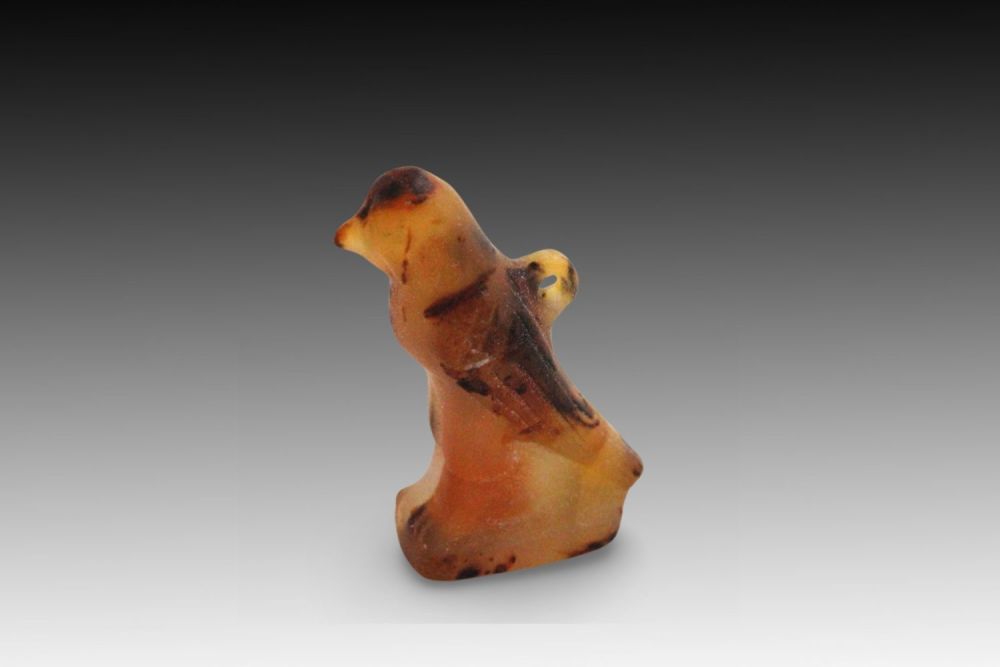 Lot 329: An Ancient Egyptian Carnelian Falcon Pendant from the...