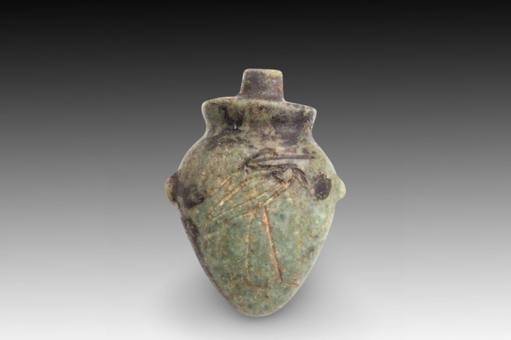 Lot 330: An Egyptian Green Heart-Shaped Stone with Intricate Hieroglyphic...