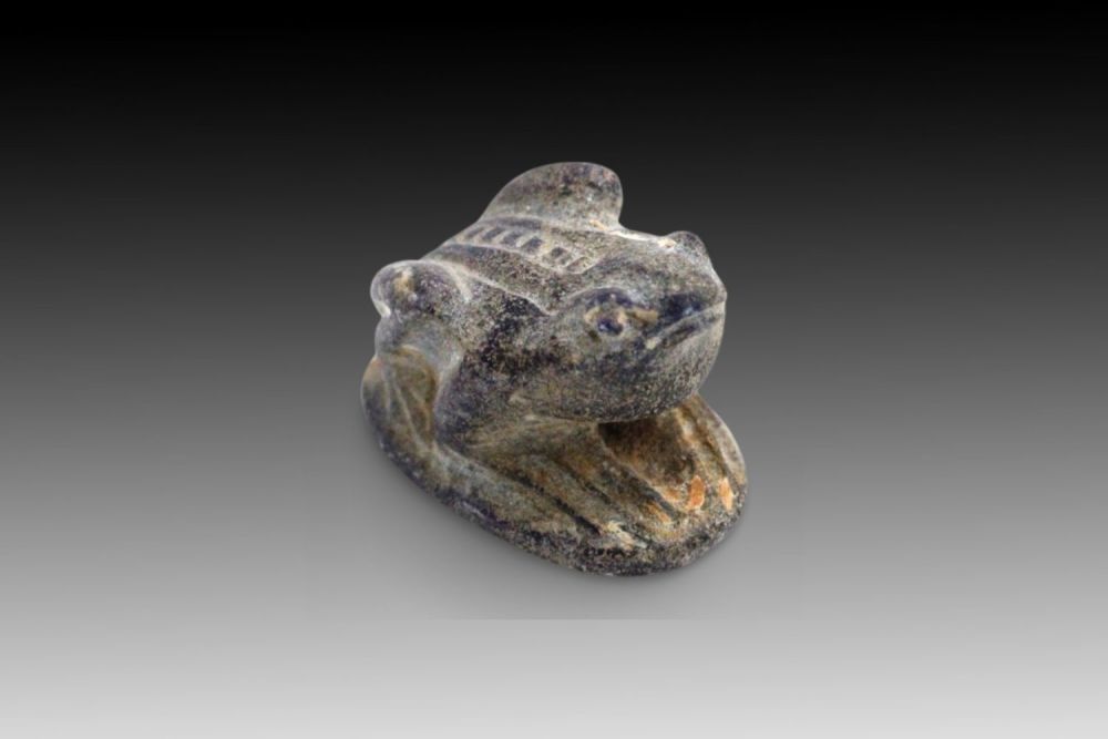 Lot 334: An Ancient Egyptian Frog-Shaped Stamp Carved from Black...