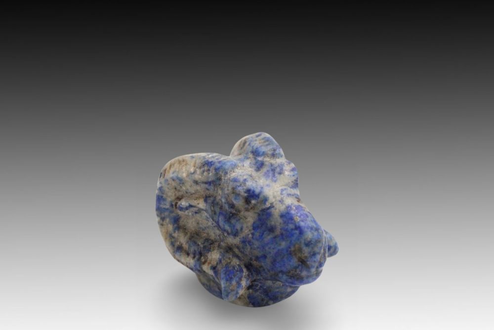 Lot 338: An Egyptian Lapis Lazuli Ram Head Pendant from...