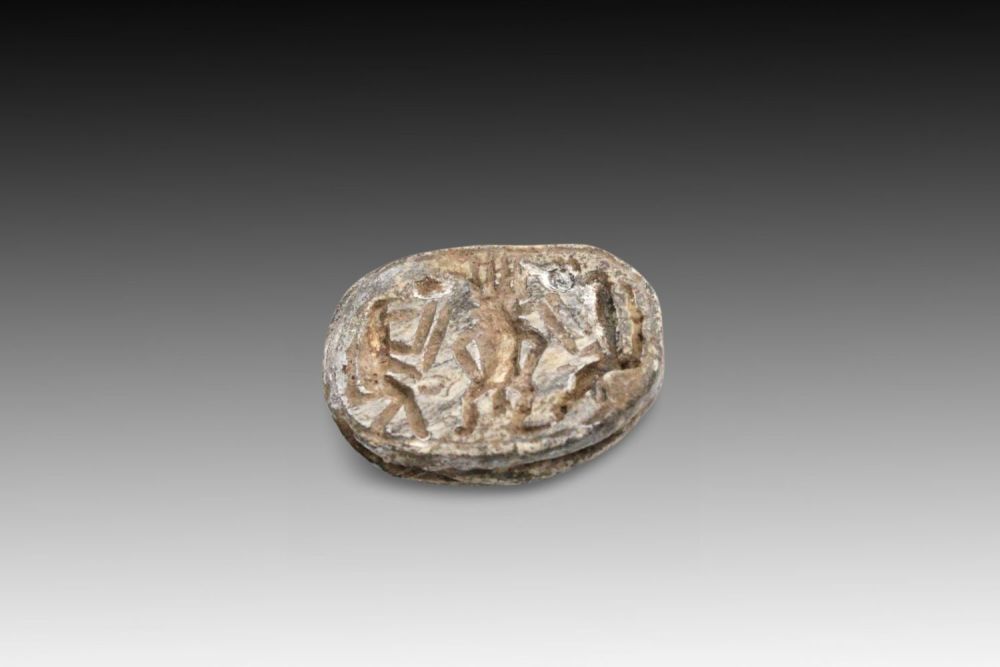 Lot 340: An Ancient Egyptian Faience Scarab, Symbol of Rebirth...