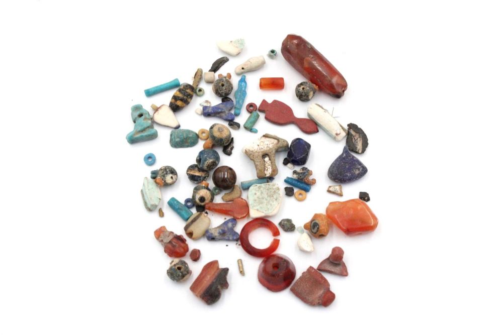 Lot 351: A Collection of Egyptian Beads.