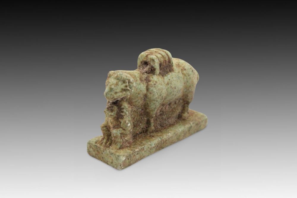 Lot 353: An Ancient Egyptian Faience Goat Pendant from 664-332...