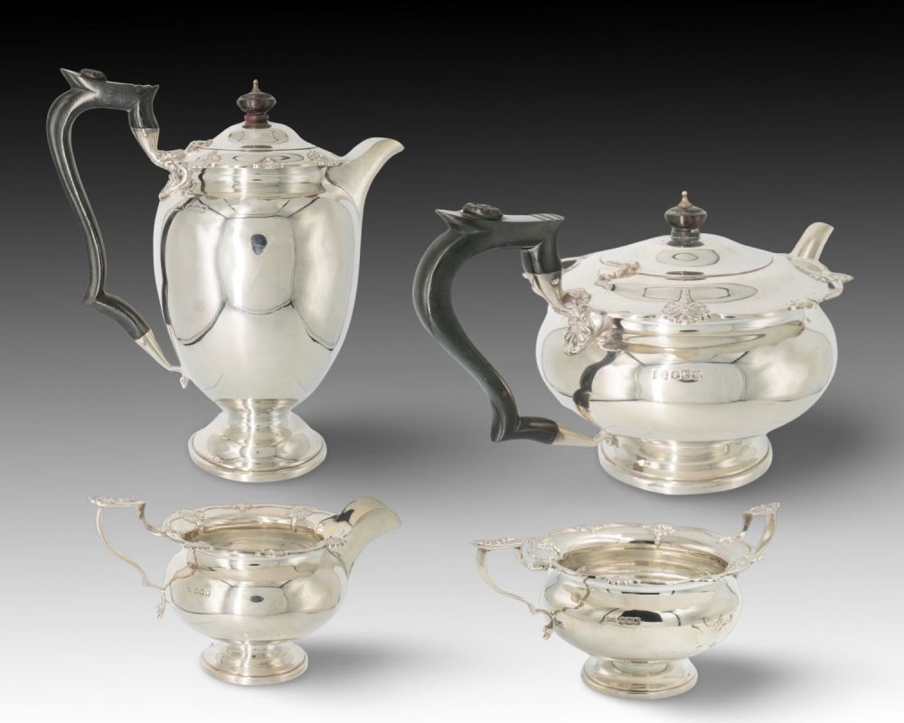 Lot 395: A Walker & Hall Sheffield Silver Tea Set...