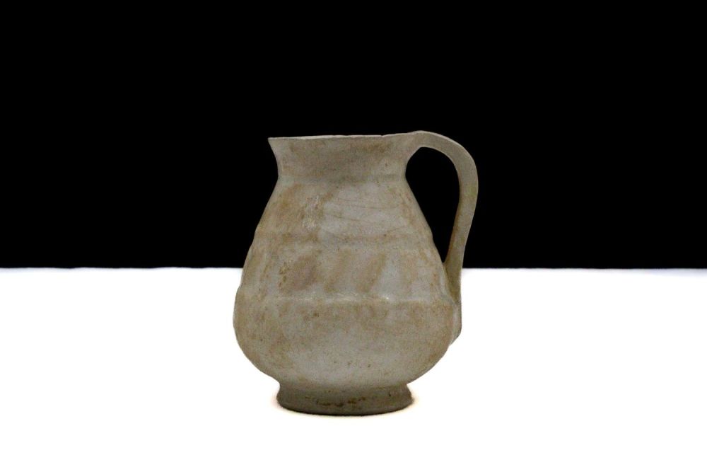 Lot 47: An Islamic Miniature Ceramic Jug from the 12th...