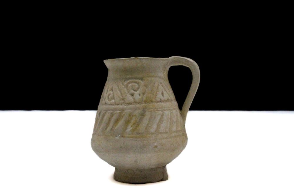 Lot 48: An Islamic Miniature Ceramic Jug from the 12th...
