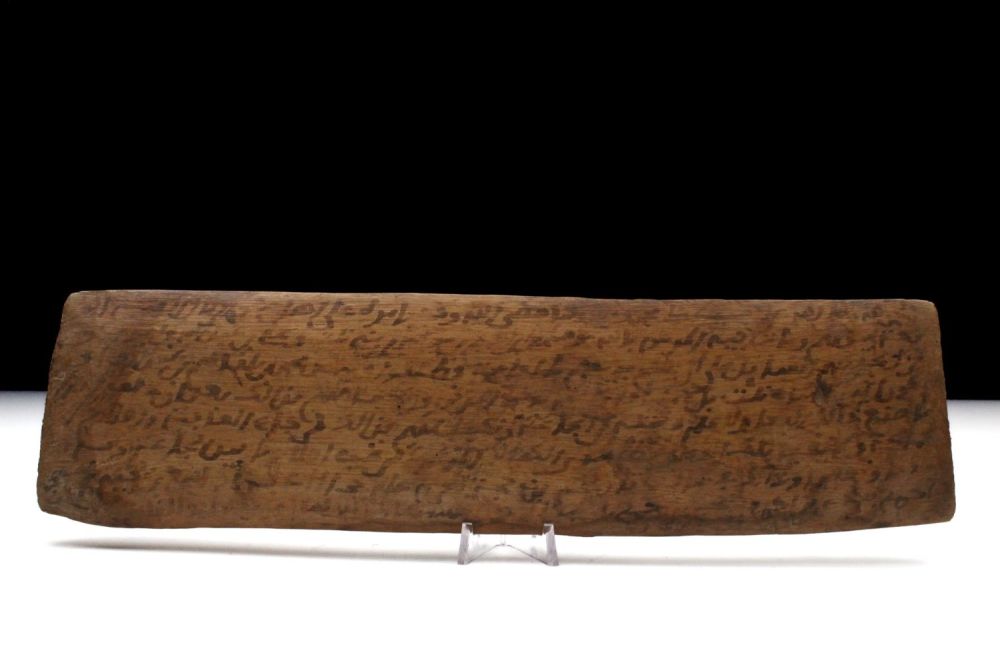 Lot 77: An Islamic Wood with Arabic Inscriptions.
