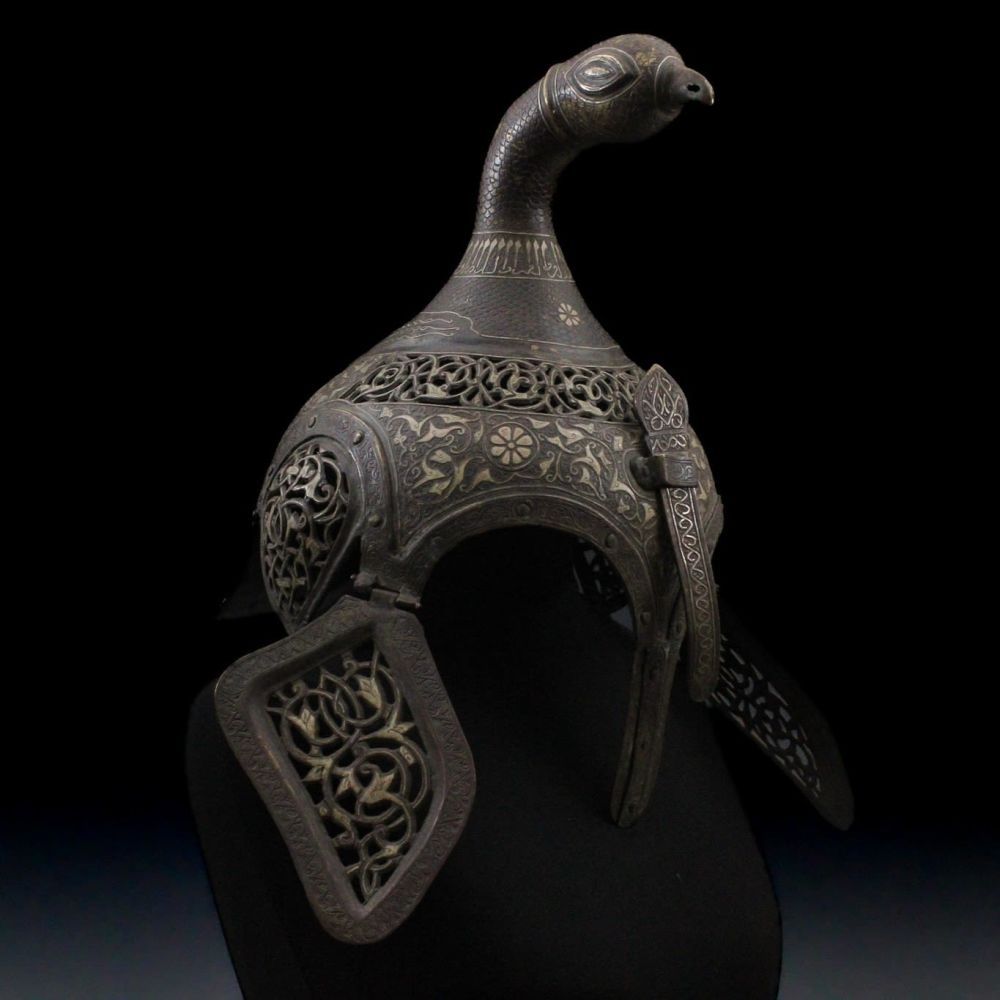 Lot 91: An Indian Islamic Brass Helmet with Openwork in...