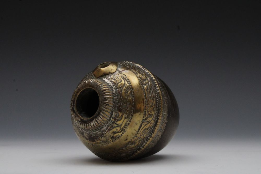 Lot 156: An Indian Brass Coconut Shaped Hookah Base from...