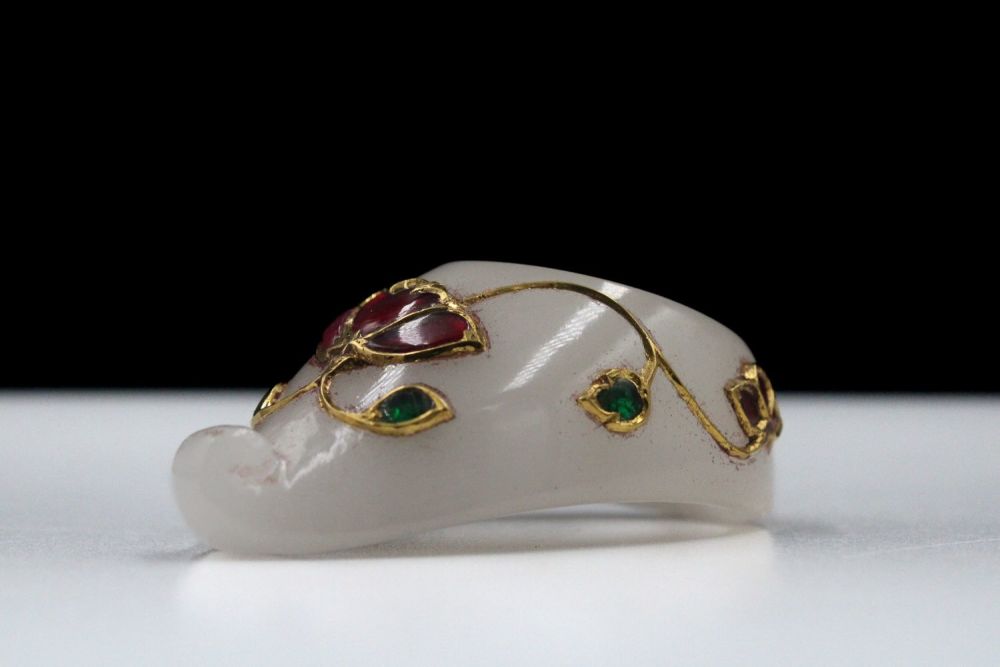 Lot 170: An Indian Thumb Ruby Ring with Emeralds on...